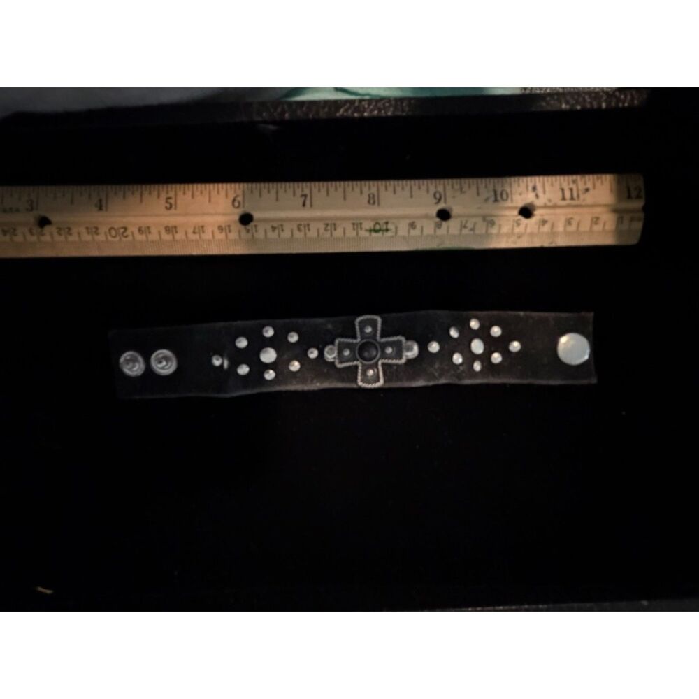vtg. suede wristband with metal cross an stud embellishments